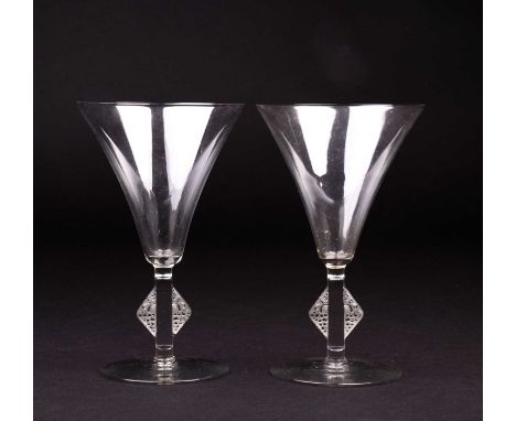 René Lalique: a pair of Art Deco Saverne pattern wine or cocktail glasses, the square stems with applied triangular mounts, e