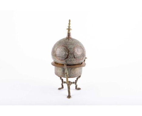 A mid 19th century Moroccan copper incense burner, of domed architectural/mosque form with moon crescent finial, with Arabic 