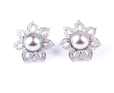 A pair of diamond and Tahitian pearl floral earrings, each set with a large grey pearl of approximately 1.3 cm diameter, the 