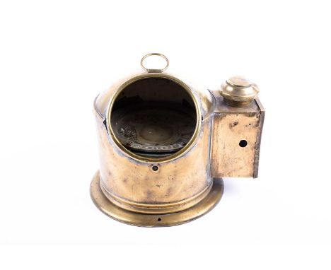 A brass cased ship's binnacle of domed form with conjoined light box, the gimbal mounted compass inscribed J. Bruce &amp; Son