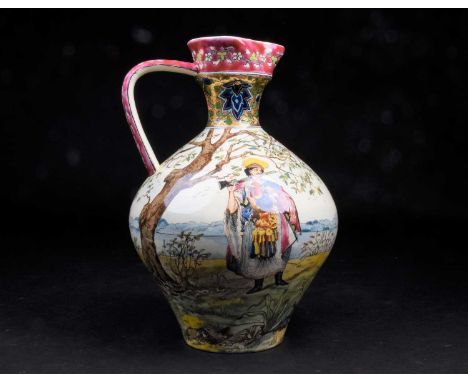 An early 20th century Fischer Budapest ceramic ewer / water pitcher, the body decorated inpolychrome enamels with traditional