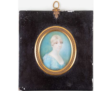 An 18th century oval portrait miniature on ivory, head and shoulders protrait of a lady, in an ebonised and gilt-mounted wood