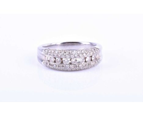 A diamond triple row band ringchannel set to centre with round brilliant-cut diamonds between two rows of pave-set diamonds, 