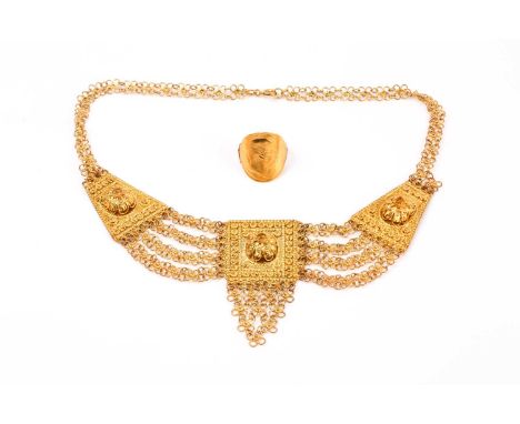 An unusual gilt metal chain-link and filigree bib necklace, with stylised detail to three panels, together with a yellow meta