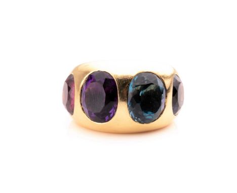 Natan. An 18ct yellow gold and multi-gem cocktail ring, the wide band set with four mixed oval-cut gems including tourmaline 