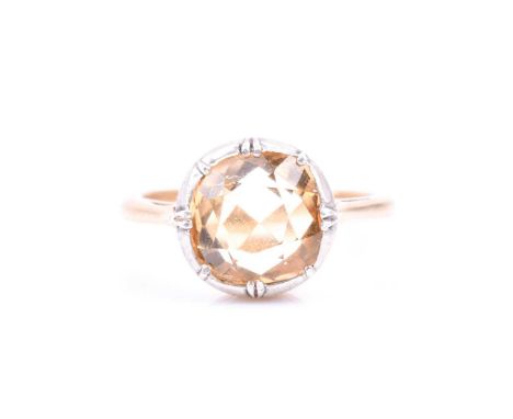 A yellow metal and citrine ring, the cushion-cut citrine in a silver mount setting, yellow metal shank unmarked, size M 1/2, 