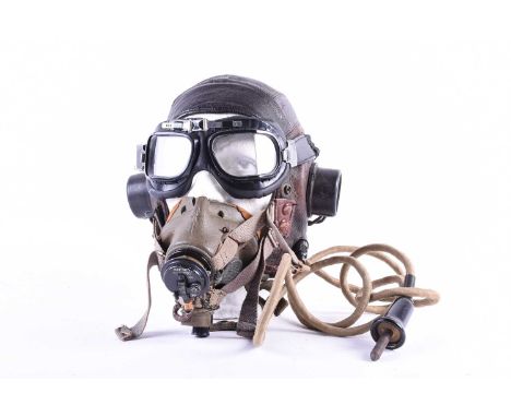 A WWII era leather 'C' type flying helmet and related equipment, to include built-in ear phones, model G face mask and (later