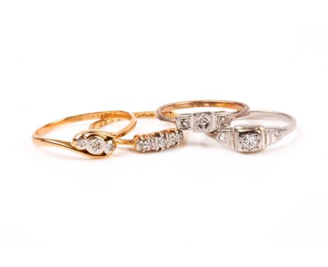 An 18ct yellow gold and diamond accent crossover ring, size O, together with another 18ct ring set with three diamond accents