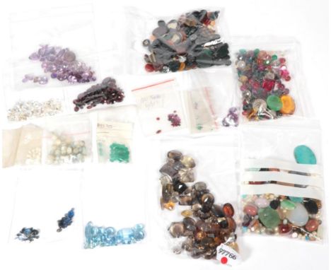 A quantity of loose stones, including citrines, smokey quartz, amethyst, intaglios and pastes