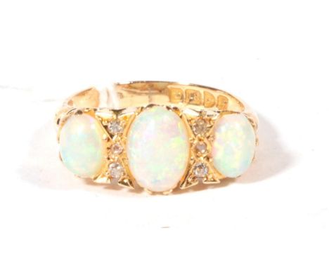 An 18ct gold opal and diamond ring, finger size N, 5.7g