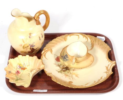 A Royal Worcester blush ivory jug; a shell dish; a shell shaped plate; a cup and saucer