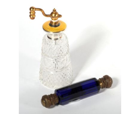 A sterling silver, yellow guilloche enamel and glass atomiser; together with a Victorian Bristol Blue double ended scent bott