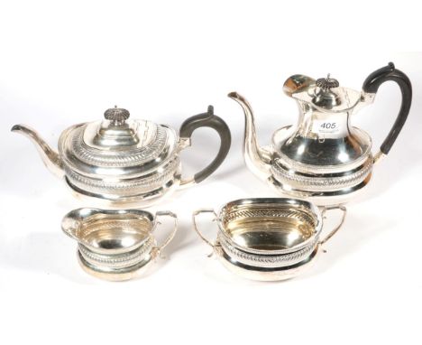 A late Victorian silver four piece tea and coffee service, Gibson &amp; Langman, London 1899, engraved with a lion rampant cr