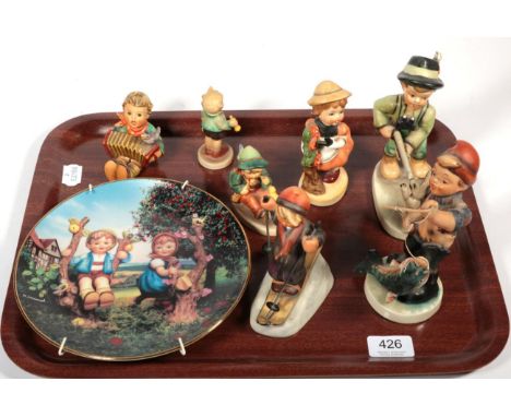Four Goebel figures; a Hummel transfer printed plate; two German figures; and a foreign figure