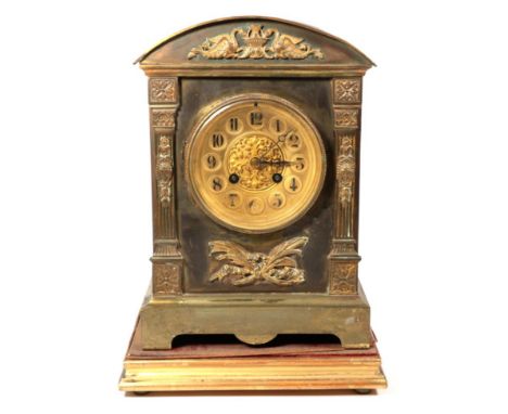 A brass mantel clock and stand 