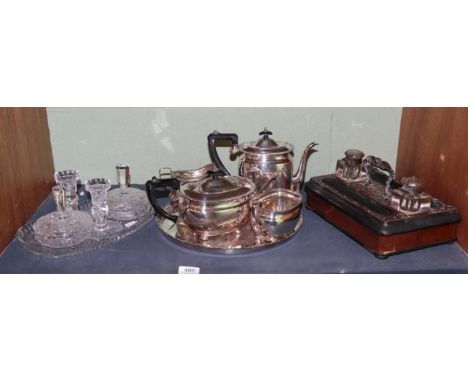 A Victorian walnut and part ebonised desk stand; a four piece electroplated tea and coffee service by Elkington; and a cut gl