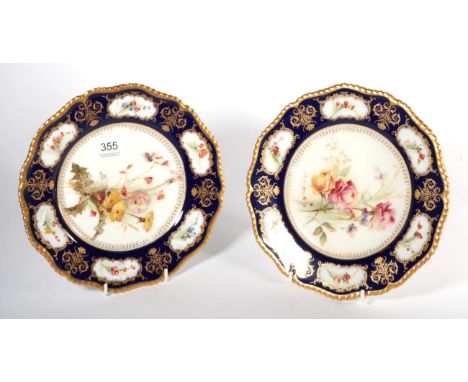 A pair of Royal Worcester blue ground floral decorated cabinet plates, 23cm diameter