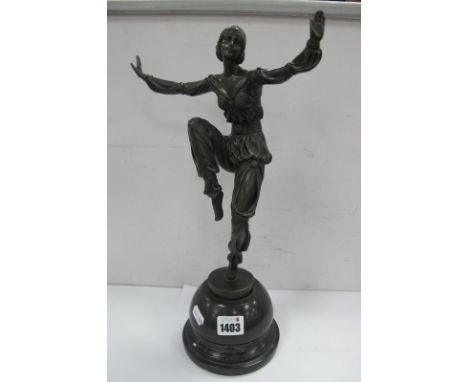 A Bronzed Figure of an Art Deco Dancing Lady, on a turned base signed P. Laúrel, 38cm high.