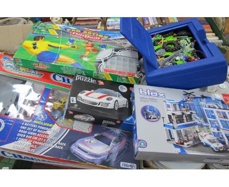 A Collection of Modern Toys, including K-Nex Wilko Blox, MB Pro Action Football, Peterkin Turbo Changer slot car racing set, 