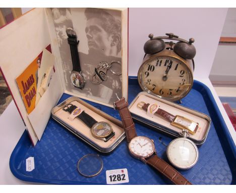 A 1980's James Dean Limited Edition Fossil Watch Set, two further Fossil watches in tins, a Victorian double bell alarm clock