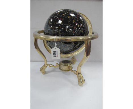 Extra Terrestrial Globe, in brass stand, having three legs, united by compass, approximately 34cm high.