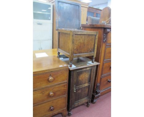 A 1920's Oak Bedside Cupboard, with a low back, panelled door, together with a commode. (2).