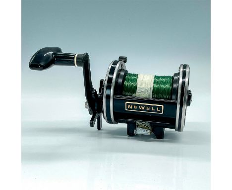 Vintage collectible Newell Jigging Reel that has the stainless-steel post frame across the top of the reel for added strength