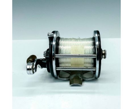 Penn No. 165 Light Tackle surf casting reel featuring nickel plated brass frame, black side plates and spool, counter balance
