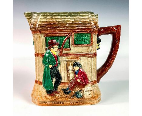 Glazed porcelain pitcher embossed with scenes from the novel Oliver Twist with quote depicting each scene at the bottom of pi
