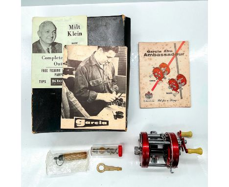 Gorgeous metallic red reel with stainless hardware and logo shield. This item has its original display box which measures 6.5