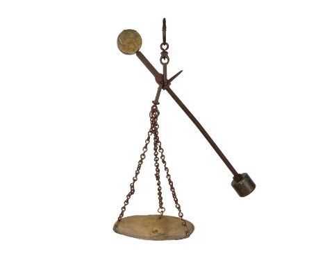 A large, heavy scale made from brass and other metals including chain link, hooks, scale pan. Dimensions: 26"L x 10.25"W x 26