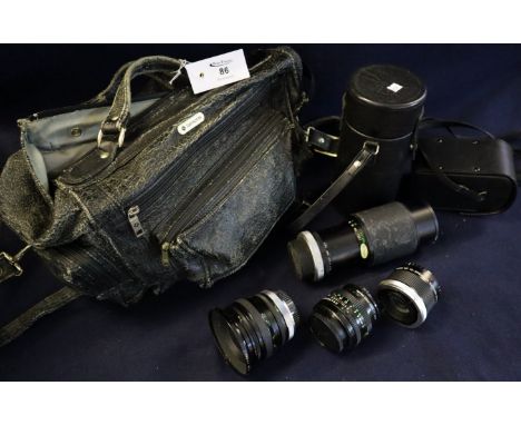 Sonite soft leather bag containing various 35mm SLR camera lenses, Eveready camera case, a vanguard photographic tripod and t