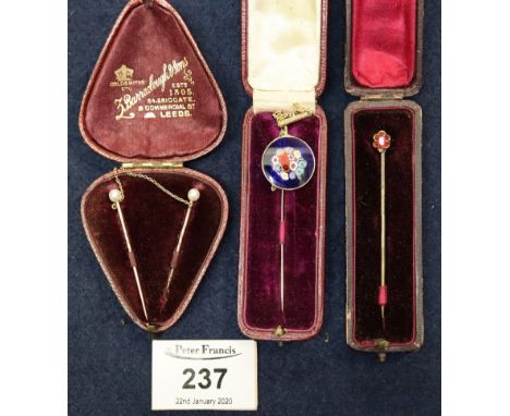 Victorian pearl set cloak clasp in 'Leed's Goldsmiths' box and two cased stick pins. (B.P. 24% incl. VAT)