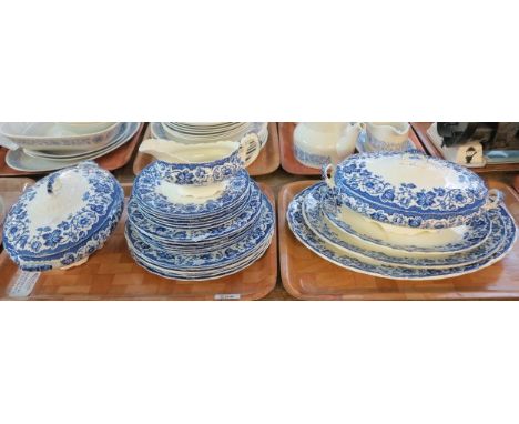 Two trays of early 20th Century transfer printed blue and white foliate dinnerware to include; graduated set of of three oval