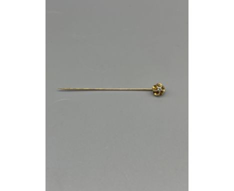 Diamond stick pin.