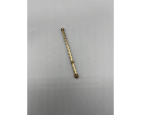 Asprey and Co 9ct gold crown finialled swizzle stick.