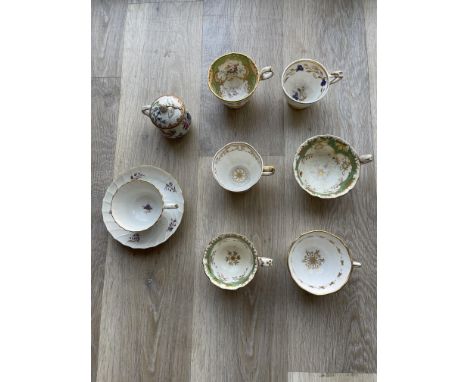 Eight C1830 ornate cabinet cups.
&nbsp;
Condition Report:
Two cups with hairline cracks but structurally sound, dull when fli