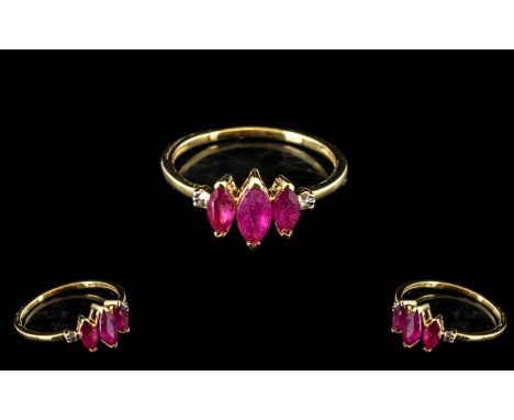 Ruby Marquise Trio and Diamond Ring, three marquise cut rubies, the centre stone larger than the ones either side, accented w