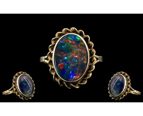 Ladies - Attractive 9ct Gold Single Stone Opal Set Ring, Excellent Setting. Fully Hallmarked for 9.375. The Oval Shaped Opal 