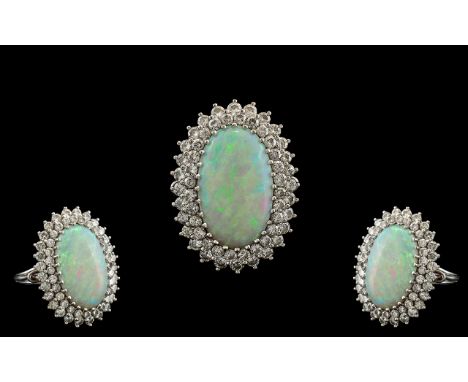 18ct White Gold - Superb Quality Opal and Diamond Set Dress Ring or Impressive Proportions / Design. The Central Oval Shaped 