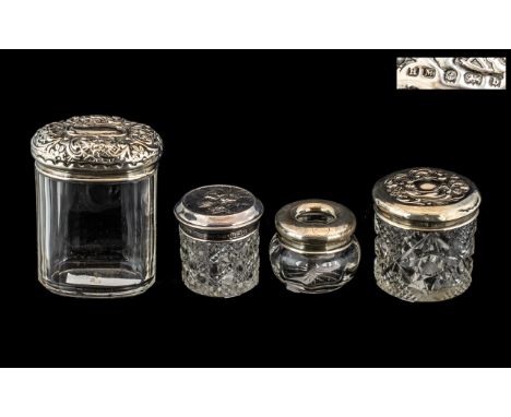 Four Edwardian Embossed Silver Cut Glass Trinket Boxes, Chester and Birmingham makers of the period; tallest 4.25 inches (10+