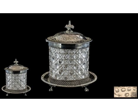 Victorian Cut Glass Biscuit Barrel with a silvered metal base on clawed feet, with a matching engraved lid with a floral fini