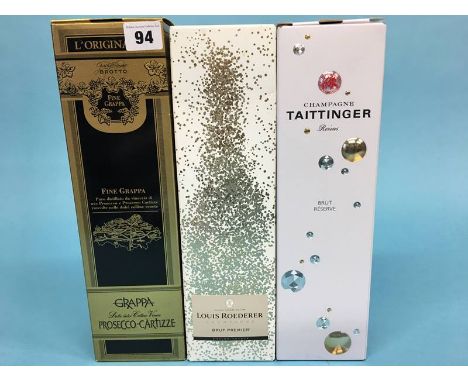 A bottle of Grappa Prosecco Cartizze, a bottle of Louis Roederer Champagne Brut Premier and a Taittinger Reims Brut Reserve (