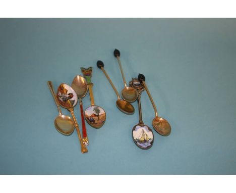 Three enamelled coffee bean spoons and five various enamel spoons