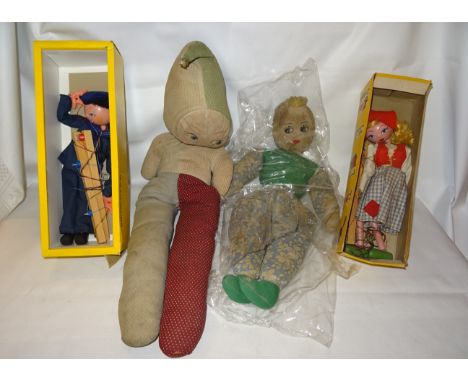 A Pelham Sailor Puppet, another and two google eyed dolls.