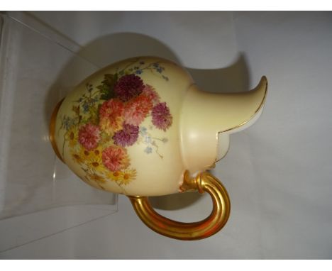 A Royal Worcester Jug with gilt loop handle, painted with sprays of flowers on a blush ivory ground, date code for 1897.   6"
