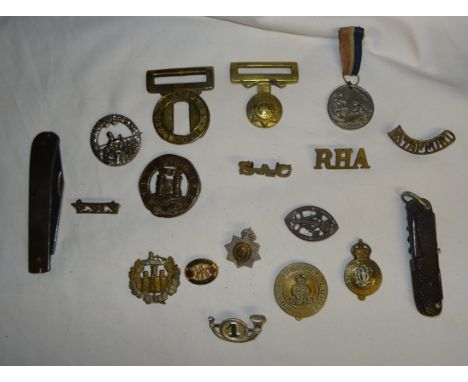 A Dorset Shire Regiment Helmet Plate Centre, Grenades Guards brass belt buck, various military badges and a Victorian Manches