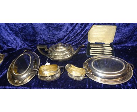 A plated oblong three piece Teaset with embossed decoration, two plated oblong entree dishes and a set of six mother of pearl