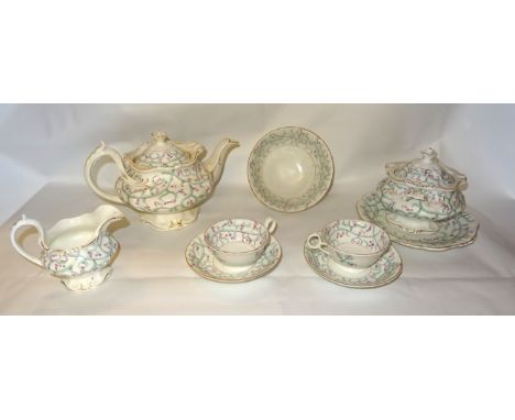 A Victorian Tea Set decorated in pale green and pink comprising; eleven breakfast cups, seven tea cups, twelve saucers, two b