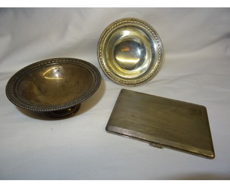 A pair of small silver circular Pedestal Bowls with border decoration, Sheffield, 1920 and an engine turned silver cigarette 